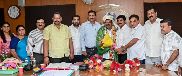 K. Ere Gowda as Maimul President First time honoring H.D. Kote!